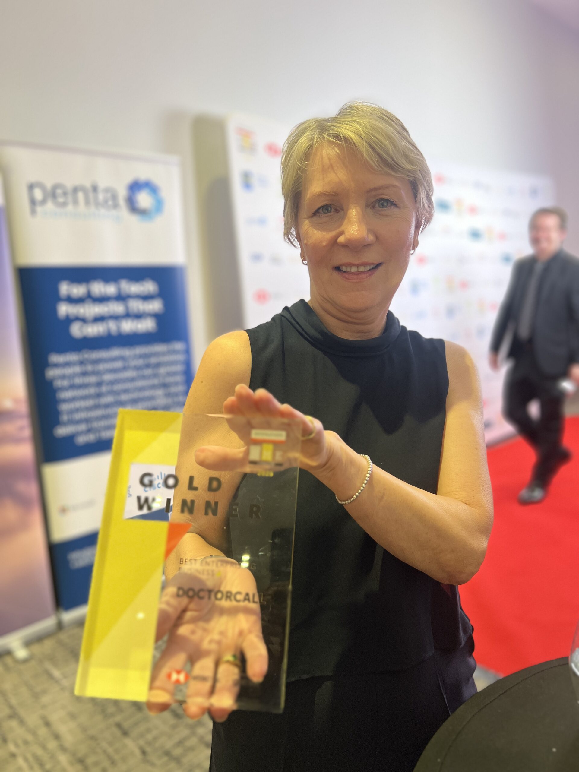 Wendy Carpenter holding the Gold award
